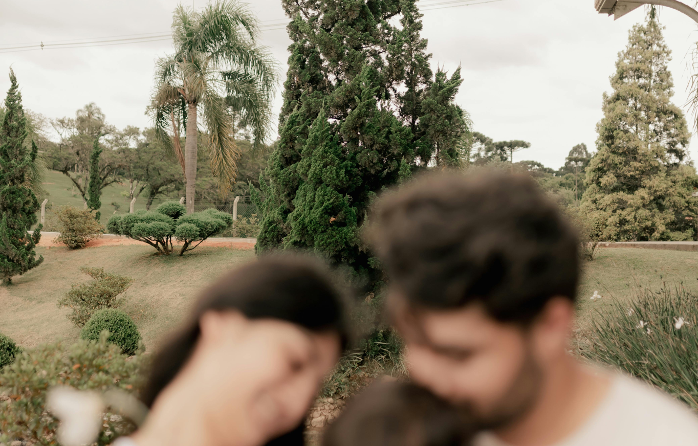 Soft focus family scene in a tranquil garden setting, evoking warmth and intimacy.